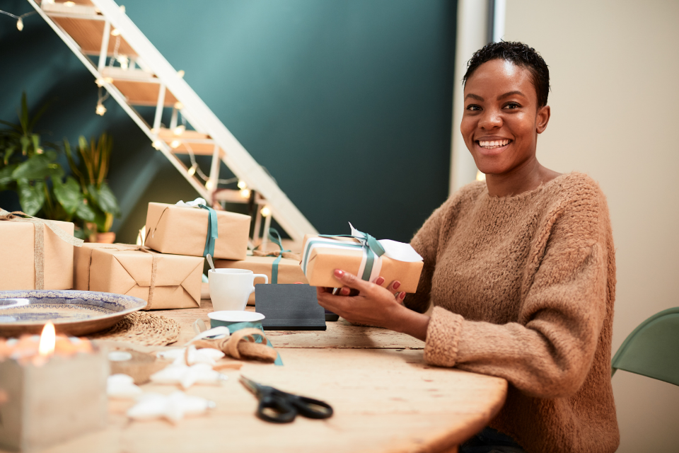 Woman wrapping up Christmas presents